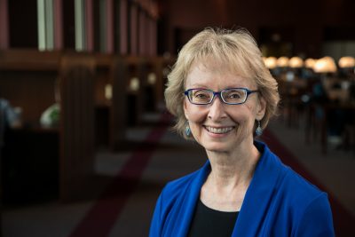 Professor Martha Ann Bell poses at Torgersen bridge 